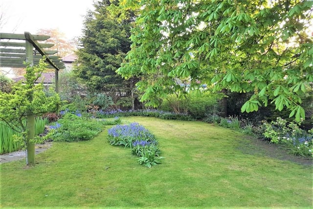 An extensive garden plot is an advantage of the property.
