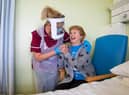 Margaret Keenan, 90, who was the first patient in the UK to receive the Pfizer/BioNtech covid-19 vaccine, with Healthcare assistant Lorraine Hill, preparing to leave University Hospital, Coventry, Warwickshire, the day after receiving the first of two doses of the vaccine.