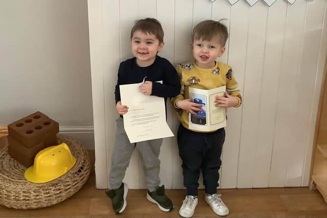 Children at Nurserytime South Shields with their card from the Queen.