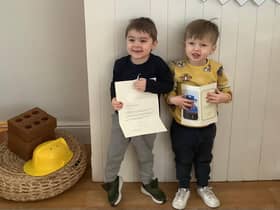 Children at Nurserytime South Shields with their card from the Queen.