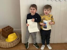 Children at Nurserytime South Shields with their card from the Queen.