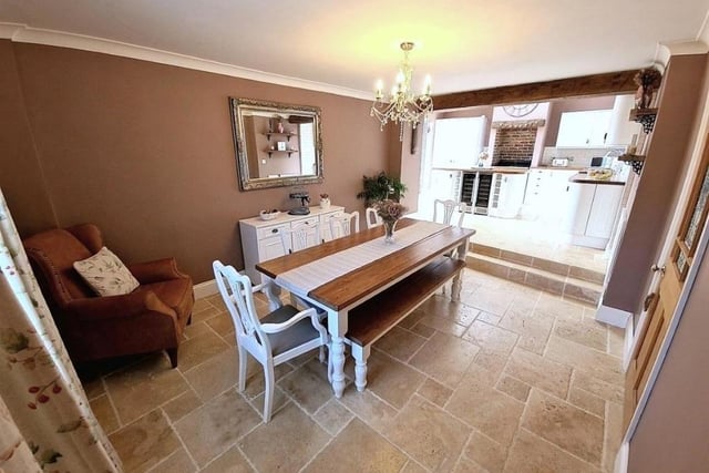 The open plan kitchen leads to the dining room.
