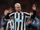 Newcastle United midfielder Bruno Guimaraes gestures to the fans after the final whistle.