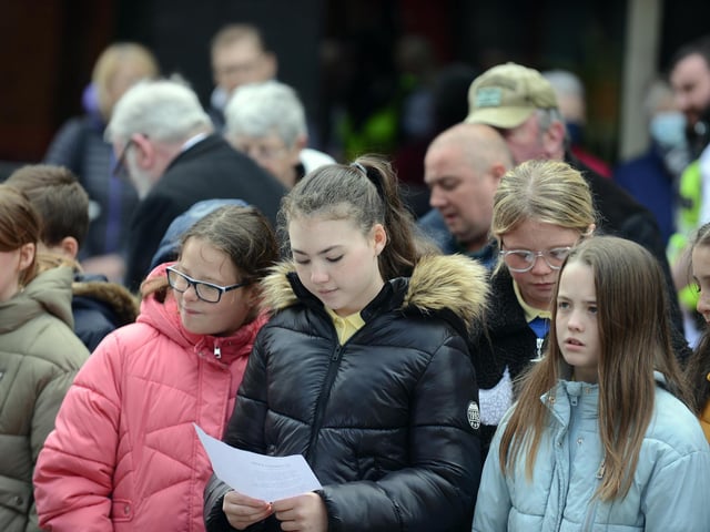 Local school children attend the Anzac Day service at the John Simpson Kirkpatrick memorial statue.