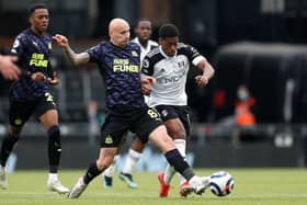 Jonjo Shelvey of Newcastle United tackles Ivan Cavaleiro of Fulham.