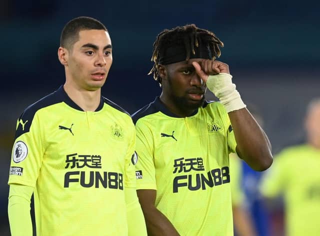 Miguel Almiron and Allan Saint-Maximin of Newcastle look on during the Premier League match between Leicester City and Newcastle United at The King Power Stadium on May 07, 2021 in Leicester, England.