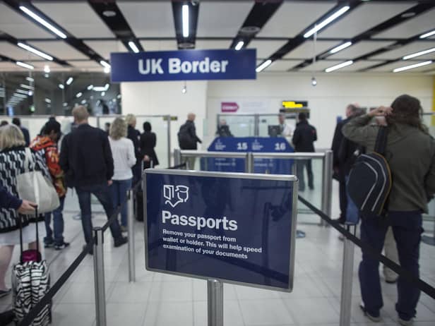 Border Force check the passports of passengers arriving. Photo: Getty Images