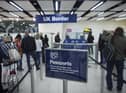 Border Force check the passports of passengers arriving. Photo: Getty Images