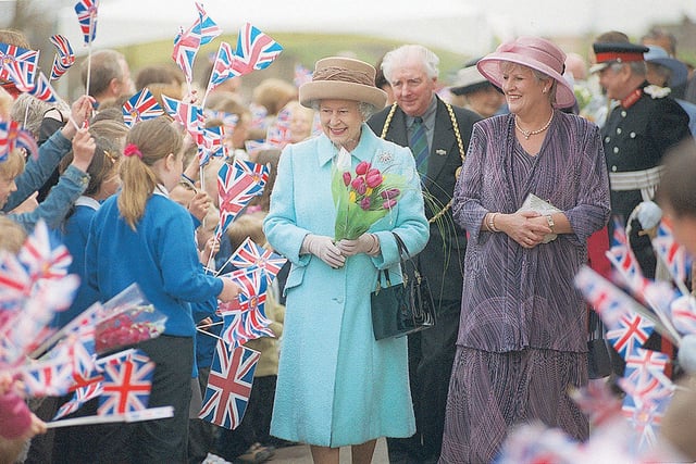 Flags galore as the Queen is made welcome in 2002.