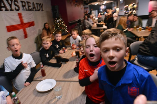 Children show their emotions as England have a near miss.
