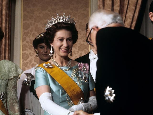Queen Elizabeth II meeting guests at a banquet given by Grand Duke Jean of Luxembourg. 11/11/76