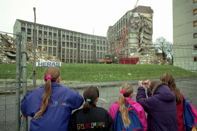 Children watching the old Westburn blocks of flats being demolished at Wester Hailes, Edinburgh. Picture taken January 1993.