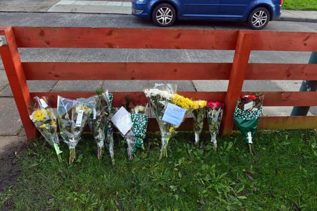 Tributes left at the property in Seton Avenue