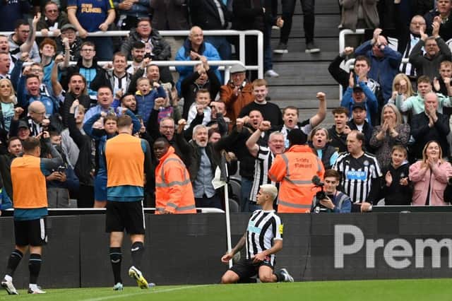 Bruno Guimaraes of Newcastle United celebrates after scoring their team's first goal during the Premier League match between Newcastle United and Brentford FC at St. James Park on October 08, 2022 in Newcastle upon Tyne, England. (Photo by Stu Forster/Getty Images)