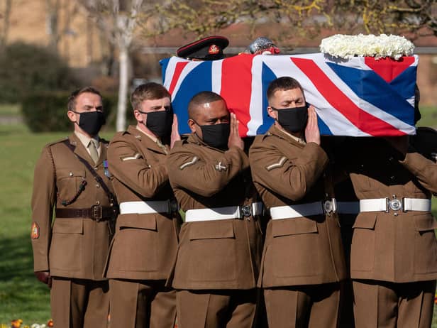 The coffin of Captain Sir Tom Moore is carried by members of the armed forces during his funeral at Bedford Crematorium. Picture: Joe Giddens/PA Wire