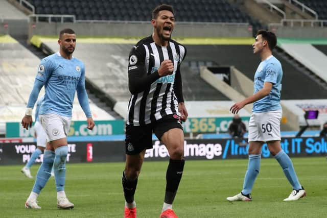 Joelinton celebrates his penalty.