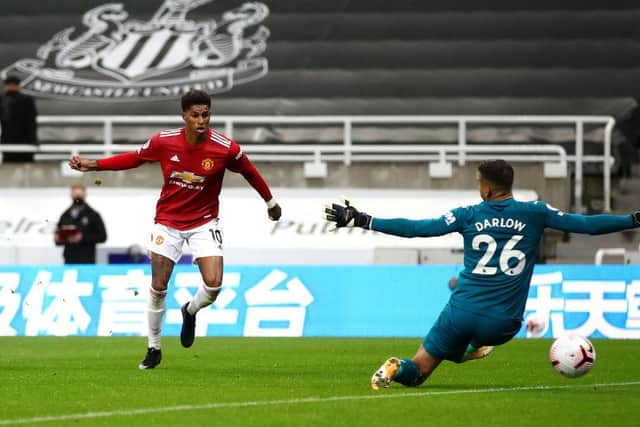 Marcus Rashford of Manchester United scores his team's fourth goal past Karl Darlow of Newcastle United during the Premier League match between Newcastle United and Manchester United at St. James Park on October 17, 2020 in Newcastle upon Tyne, England.