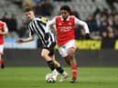 Scott Bailey (left) scored a late consolation for Newcastle United (Photo by David Price/Arsenal FC via Getty Images)