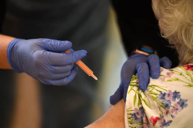 A patient getting the Oxford/AstraZeneca vaccine (Photo by OLI SCARFF/AFP via Getty Images)