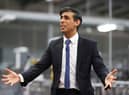 Rishi Sunak talks to local business leaders during a visit to a Coca-Cola factory in Lisburn, Northern Ireland yesterday (Picture: Liam McBurney/WPA pool/Getty Images)
