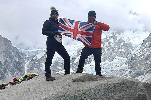 Mea with his partner Rachael Crooks and the Union Jack after they had just completed the Mount Everest Base Camp Trek.