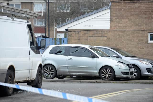 Damage to a car could be seen at the scene.