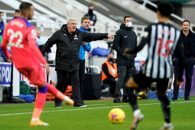 Newcastle United's English head coach Steve Bruce (2L) and Chelsea's English head coach Frank Lampard (R) watches his players from the touchline during the English Premier League football match between Newcastle United and Chelsea at St James' Park in Newcastle-upon-Tyne, north east England on November 21, 2020.