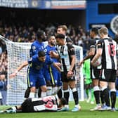 Jorginho of Chelsea and Jacob Murphy of Newcastle United interact as Bruno Guimaraes is injured.