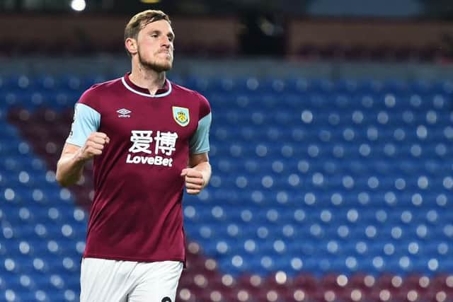 Chris Wood of Burnley celebrates after scoring their side's first goal during the Premier League match between Burnley and West Ham United at Turf Moor on May 03, 2021 in Burnley, England. (Photo by Peter Powell - Pool/Getty Images)