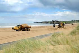 South Tyneside Council contractors at work clearing Sandhaven Beach, South Shields.