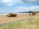 South Tyneside Council contractors at work clearing Sandhaven Beach, South Shields.