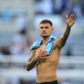Newcastle United's Brazilian midfielder Bruno Guimaraes waves to fans at the end of the English Premier League football match between Newcastle United and Manchester City at St James' Park in Newcastle-upon-Tyne, north east England, on August 21, 2022.  (Photo by Lindsey Parnaby / AFP)