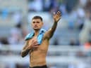Newcastle United's Brazilian midfielder Bruno Guimaraes waves to fans at the end of the English Premier League football match between Newcastle United and Manchester City at St James' Park in Newcastle-upon-Tyne, north east England, on August 21, 2022.  (Photo by Lindsey Parnaby / AFP)