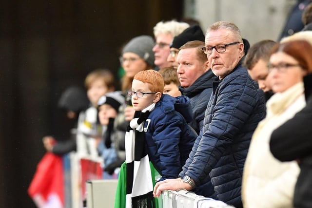 One young fan tries to get as close to the action as possible