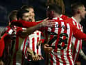 Jordan Jones celebrates his crucial goal at Fratton Park