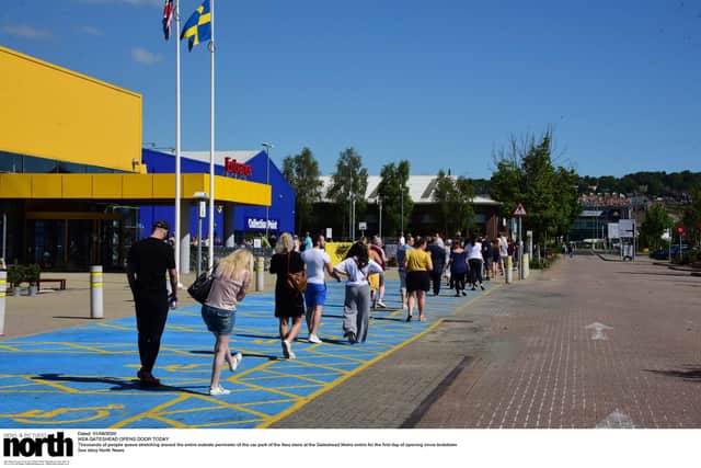 Thousands of people queue stretching around the entire outside perimeter of the car park of the Ikea store at the Gateshead Metro entire for the first day of opening since lockdown.