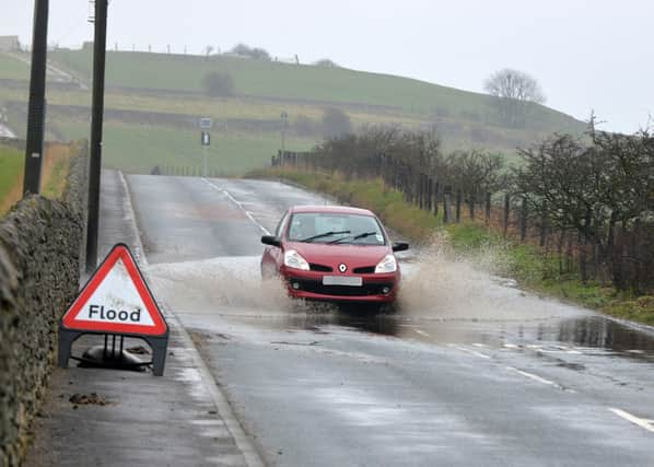 Flooding on Lizard Lane, Whitburn, in recent years. There are now plans to tackle the problem.