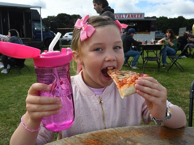 Sophie Hails enjoys her mushroom pizza at the feast.