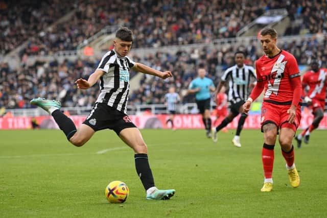 Newcastle player Lewis Miley shoots at goal despite the attentions of Rayo defender and former Newcastle defender Florian Lejeune during the friendly match between Newcastle United and Rayo Vallecano  at St James' Park on December 17, 2022 in Newcastle upon Tyne, England. (Photo by Stu Forster/Getty Images)