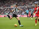 Newcastle player Lewis Miley shoots at goal despite the attentions of Rayo defender and former Newcastle defender Florian Lejeune during the friendly match between Newcastle United and Rayo Vallecano  at St James' Park on December 17, 2022 in Newcastle upon Tyne, England. (Photo by Stu Forster/Getty Images)