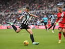 Newcastle player Lewis Miley shoots at goal despite the attentions of Rayo defender and former Newcastle defender Florian Lejeune during the friendly match between Newcastle United and Rayo Vallecano  at St James' Park on December 17, 2022 in Newcastle upon Tyne, England. (Photo by Stu Forster/Getty Images)