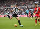 Newcastle player Lewis Miley shoots at goal despite the attentions of Rayo defender and former Newcastle defender Florian Lejeune during the friendly match between Newcastle United and Rayo Vallecano  at St James' Park on December 17, 2022 in Newcastle upon Tyne, England. (Photo by Stu Forster/Getty Images)