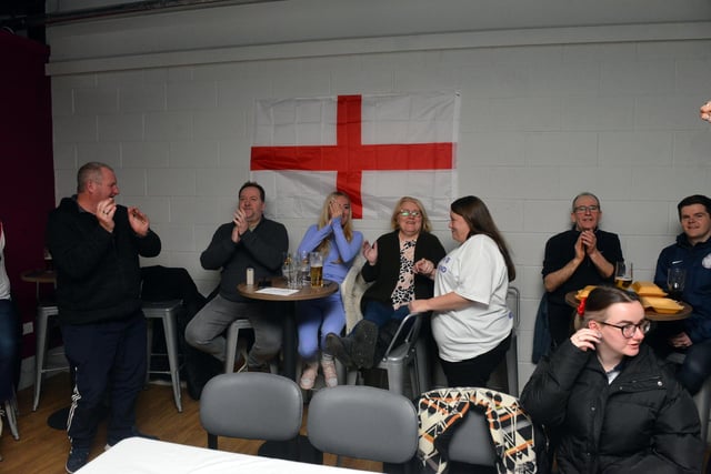 Fans applauding the England team as they made it through to the last 16 of the World Cup.