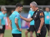 Brazil's coach Tite (R) talks to player Bruno Guimaraes of Newcastle United (Photo by DOUGLAS MAGNO / AFP) (Photo by DOUGLAS MAGNO/AFP via Getty Images)