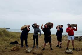 outh Shields Stone Lifters members Stuart Robertson, Bradley Wall, Michael Scott, Anthony Higgins pictured during one of their beach training sessions