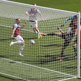 Newcastle United's Brazilian striker Joelinton (C) shoots and scores a goal during the English Premier League football match between Newcastle United and West Ham United at St James' Park in Newcastle-upon-Tyne, north east England on April 17, 2021.