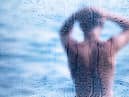 As soon as the alarm goes off, jump up turn it off, and get in the shower. Quickly shower and clean your teeth. This will wake you up straight away.