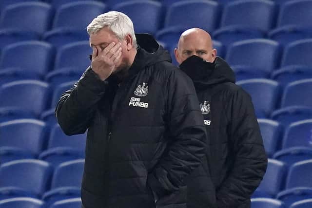 Newcastle United's English head coach Steve Bruce (L) reacts during the English Premier League football match between Brighton and Hove Albion and Newcastle United at the American Express Community Stadium in Brighton, southern England on March 20, 2021.