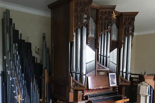 This magnificent church organ was among the musical instruments found in a doctor's living room.