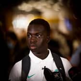 Garang Kuol of the Socceroos talks to he media on arrival at Sydney International Airport on December 05, 2022 in Sydney, Australia. (Photo by Mark Evans/Getty Images)